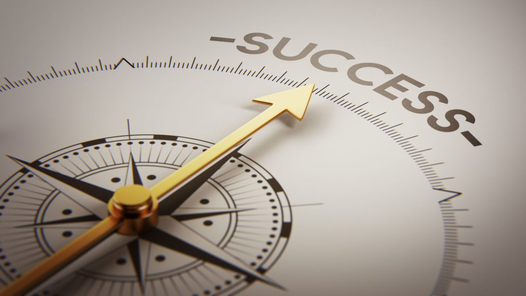 a compass with an arrow pointing to success