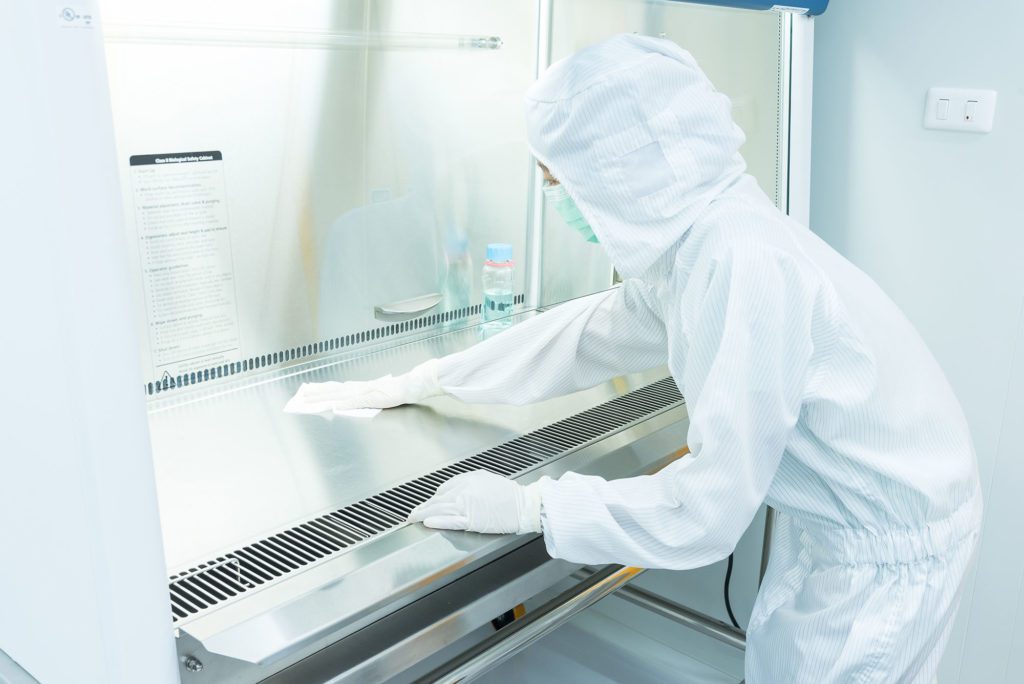 Extraction Employee in PPE cleaning Equipment